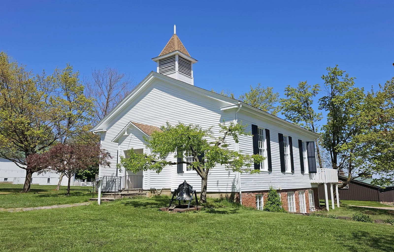 The village's historic white meeting house with its bell tower, a setting for weddings and celebrations.